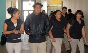 Super seniors Tania Flores and Angel Iribe walking down the halls of Animo pat brown