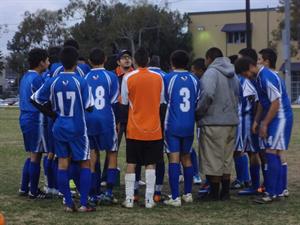 LET’S DO THIS Soccer team gathers together before the game.