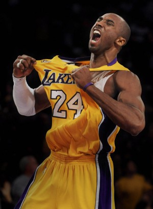 The Los angeles Lakers' Kobe Bryant exhalts after a three point shot in a game that he finished with 49 points and a 2 games to none lead over the Denver Nuggets in a NBA Western conference play-off game.